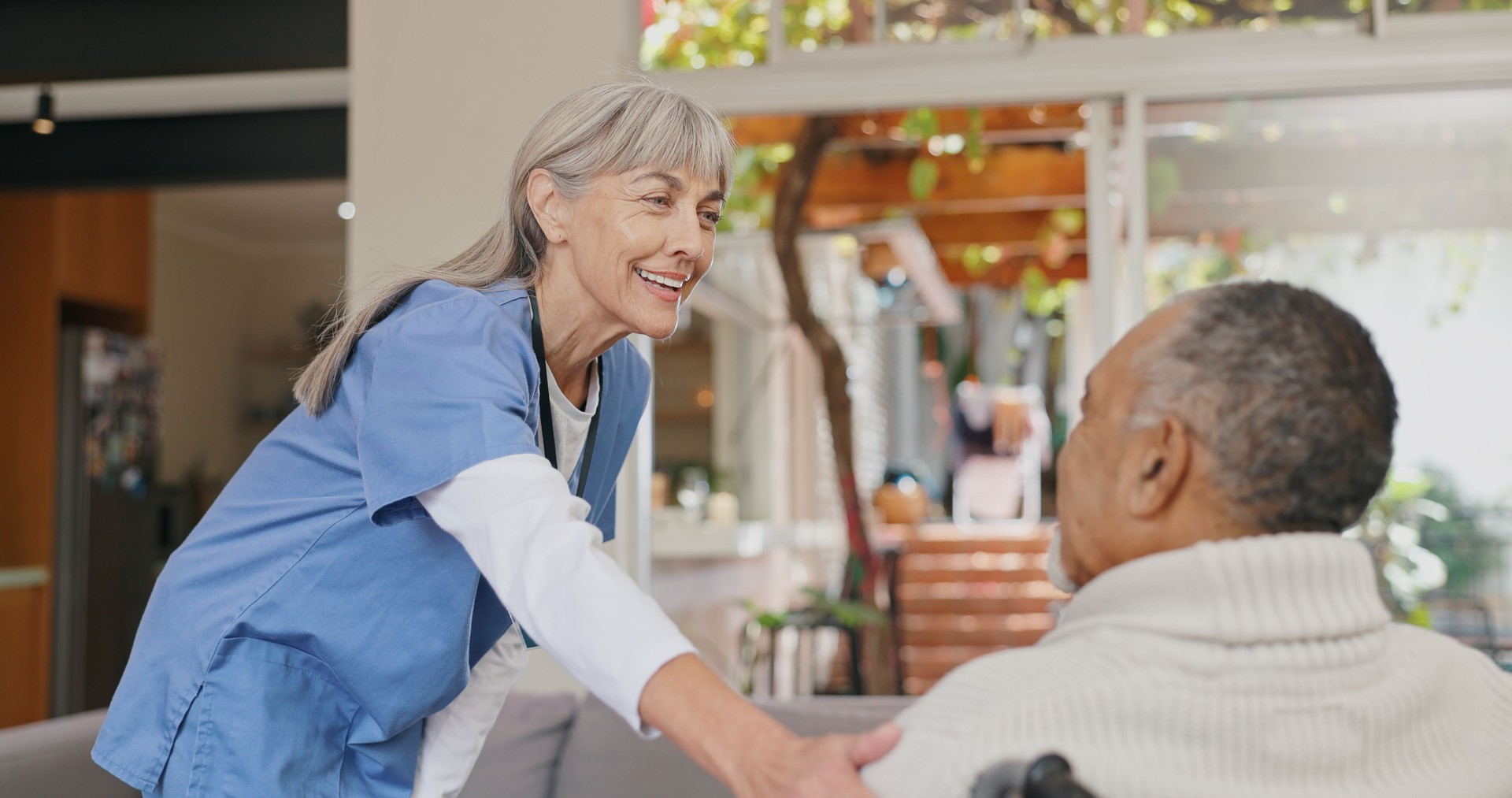 Senior care, support or hand of nurse with old man for healthcare service, wellness or empathy. Wheelchair, disability advice and caregiver helping for comfort or patient for medical check or nursing